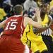 Michigan junior Tim Hardaway Jr. looks up as he moves the ball around North Carolina State senior Scott Wood during the first half at Crisler Center on Tuesday night. Melanie Maxwell I AnnArbor.com